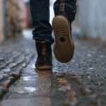 close-up photography of person walking on pavement